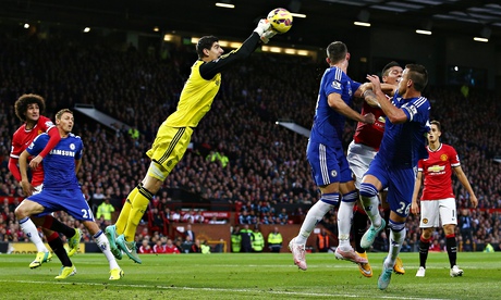 Chelsea's Thibaut Courtois punches the ball clear against Manchester United in 2014
