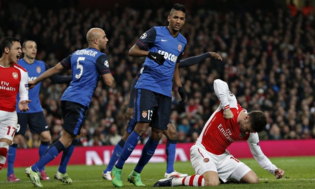 Arsenal's Olivier Giroud punches the ground in anger after missing an easy chance against Monaco