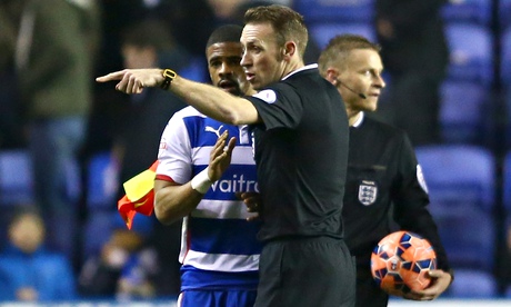 The referee's assisant speaks to Garath McCleary about the incident towards the Reading player