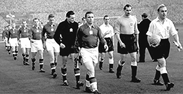 Billy Wright and Ferenc Puskas lead England and Hungary out at Wembley in 1953