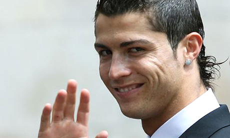 Cristiano Ronaldo holds his 'Ballon D'Or France football 2008'