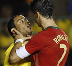 Portugal's Cristiano Ronaldo holds the neck of Brazil's Marcelo