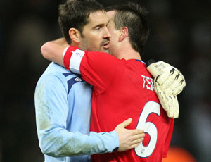 John Terry and Scott Carson hug after beating Germany