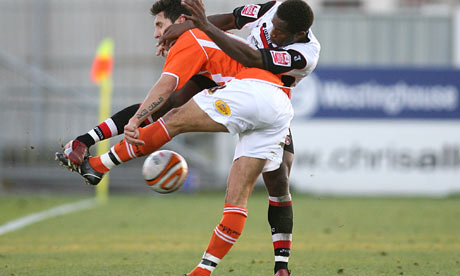 Blackpool's Joe Martin gets in a tangle with Charlton Athletic's Jose Vitor Semedo