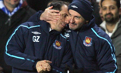 West Ham manager Gianfranco Zola is congratulated by fitness coach Antonio Pintus at Stamford Bridge