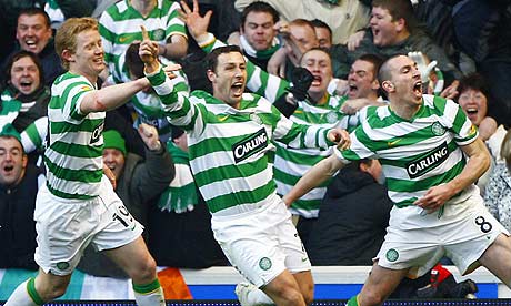 Celtic's Scott McDonald celebrates with team-mates after scoring against Rangers.