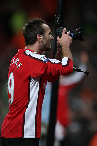 Gallery Karl Duguid: Plymouth goalscorer Karl Duguid picks up a camera to take pictures of fans