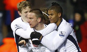 Jamie O'Hara is mobbed by team-mates after scoring Tottenham's second against Burnley