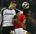 Steve Davies of Derby County goes up for a header with Anderson of Manchester United