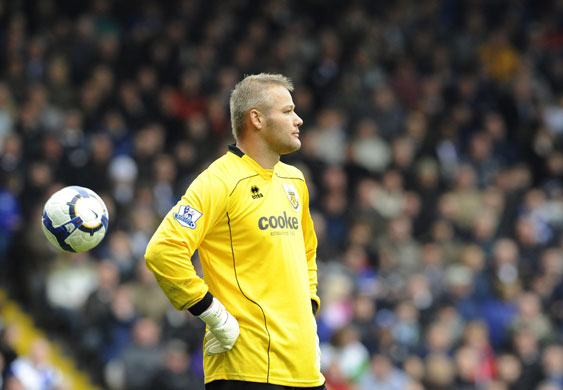 Premier League round-up: Brian Jensen looks dejected after conceding again during Burnley's defeat