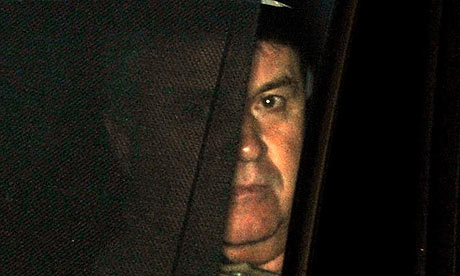 Chelsea's new manager Guus Hiddink leaves the club training ground near Cobham