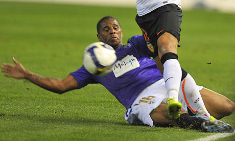 Valencia's Brazilian Carleto, right, fights for the ball with Malaga's Eli during their game