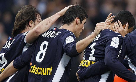 Bordeaux's Fernando Cavenaghi (left) and Yoann Gourcuff (centre) congratulate David Bellion