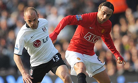 Fulham's Danny Murphy and Dimitar Berbatov battle for the ball