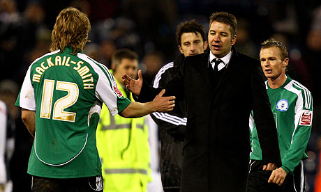 Peterborough United manager Darren Ferguson congratulates Craig Mackail-Smith