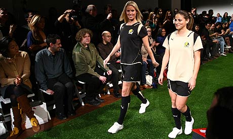 Leslie Osborne and Christina DiNartino model the FC Gold Pride team uniforms