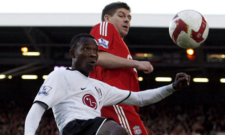 John Pantsil of Fulham and Steven Gerrard of Liverpool at Craven Cottage