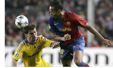Ivanovic left and Thierry Henry of Barcelona tussle in the first leg