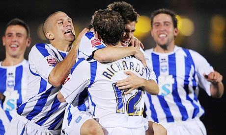 Manchester City have lost and Brighton players congratulate Matthew Richards on his decisive penalty