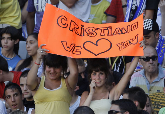 Cristiano Ronaldo: Two Real Madrid fans hold up a banner at Cristiano Ronaldo's unveiling