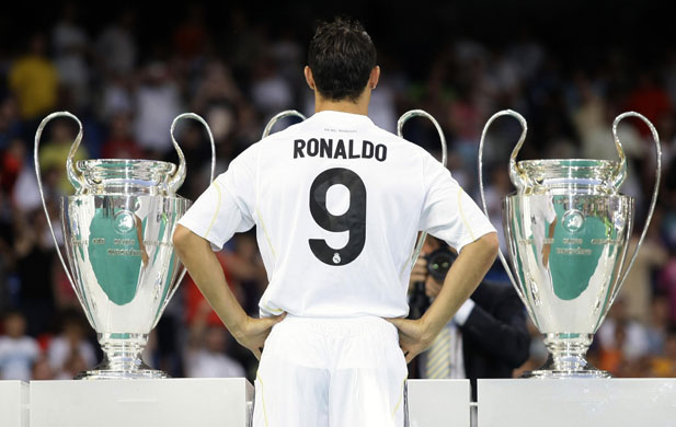 Cristiano Ronaldo: Cristiano Ronaldo poses with Real Madrid's trophies at his unveiling