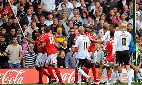 A brawl breaks out between players at the final whistle as Nathan Tyson runs past Derby County fans