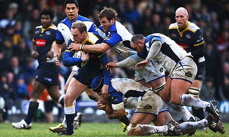 Lee Blackett of Leeds is tackled by the Bath defence during the Premiership match at Headingley