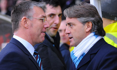 Scunthorpe's Nigel Adkins, left, and Manchester City's Roberto Mancini