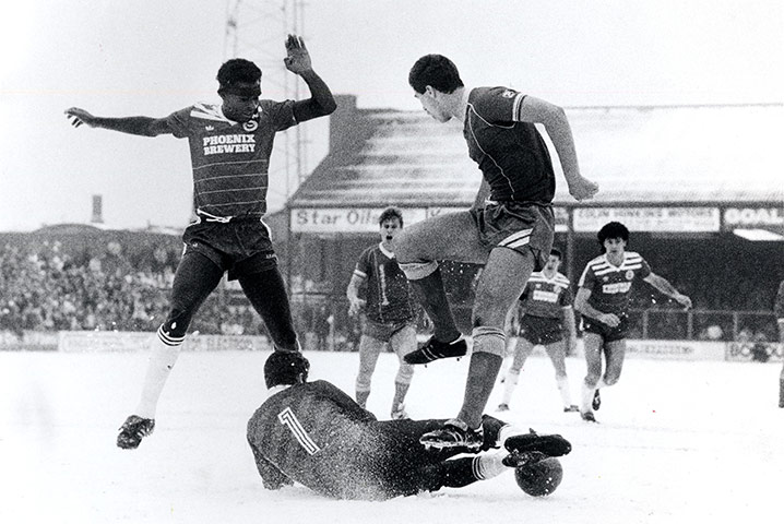 Football white-outs: Brighton and Peterborough play on a snow covered pitch
