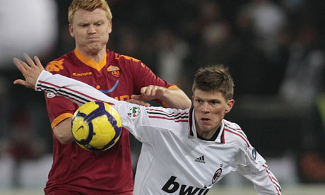 John Arne Riise challenges Klaas-Jan Huntelaar
