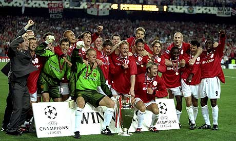 United players pose for pictures with the 1999 Champions League Trophy