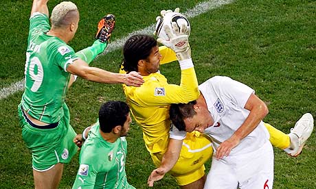 England's goalkeeper David James comes under pressure