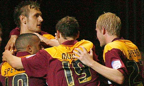 James Hanson celebrates with his Bradford team-mates after scoring against Forest