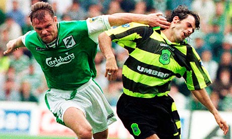John Hughes, left, in his playing days for Hibs in a game against Celtic