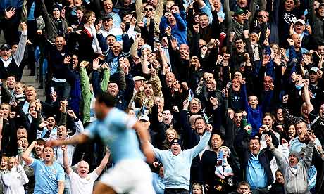 Manchester City fans celebrate Carlos Tevez scoring against Chelsea