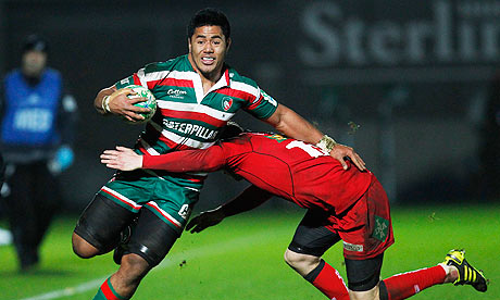Manu Tuilagi of Leicester shrugs off a challenge from Scarlets' Rhys