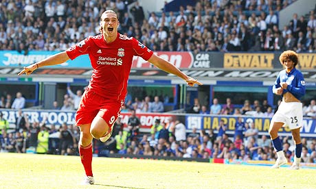 Liverpool's Andy Carroll celebrates putting his side 1-0 up at Everton