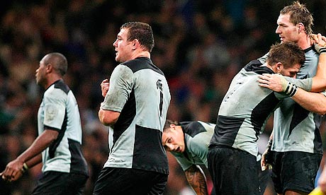 New Zealand's captain, Richie McCaw, is consoled after the 2007 quarter-final defeat to France