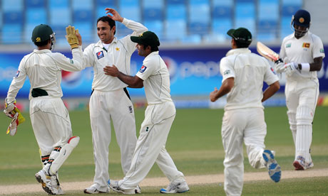 Pakistan's spinner Saeed Ajmal celebrates after dismissing Sri Lanka's batsman Suranga Lakmal