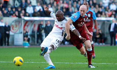 Swansea's Leroy Lita shoots against Aston Villa