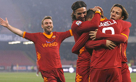 Roma's players celebrate taking the lead against Napoli