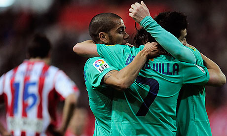 Barcelona's David Villa is congratulated by teammates after his late 