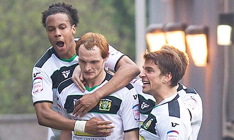 Yeovil celebrate after Shaun MacDonald completes his hat-trick in the hammering of Leyton Orient