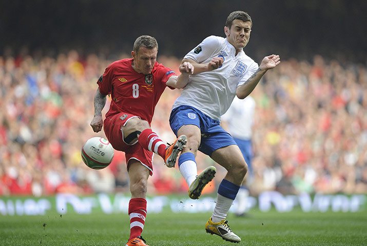 Wales v England: Jack Wilshere challenges Craig Bellamy
