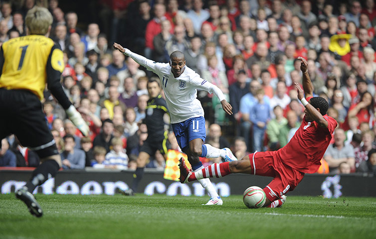 Wales v England: Ashley Young squares the ball across the six yard area