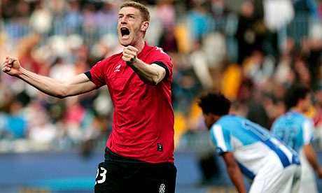 Osasuna's defender Sergio Fernandez celebrates after scoring the winning goal against Malaga