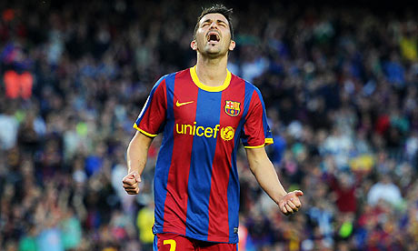 David Villa celebrates scoring Barcelona's opening goal against Osasuna