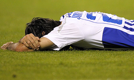 Deportivo midfielder Juan Rodriguez lies on the pitch at the end of the 1-0 defeat to Valencia