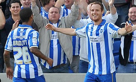 Brighton's Ryan Harley (right) celebrates scoring his sides second goal against Peterborough