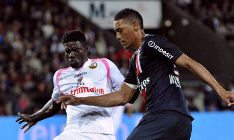 Lorient's Brunoe Ecuele Manga vies with Paris Saint-Germain's Guillaume Hoarau
